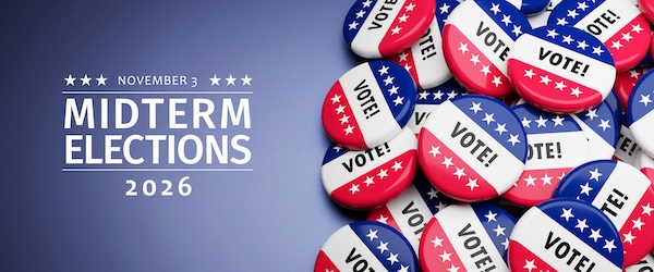 November 3: Midterm Elections 2026. A pile of red, whtie and blue VOTE! buttons on a blue background.